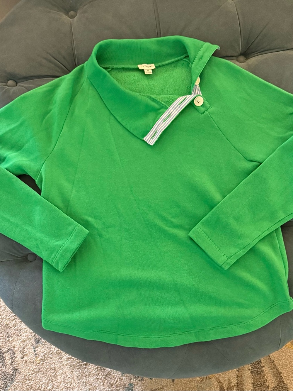 J Crew size medium green light sweatshirt, a 4 button neck opens to blue white
